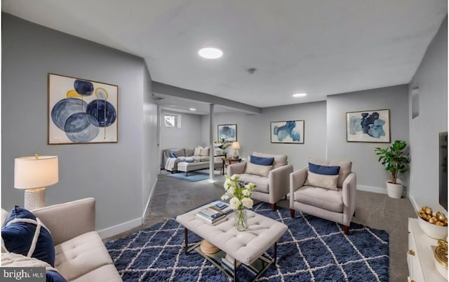 living room featuring dark colored carpet