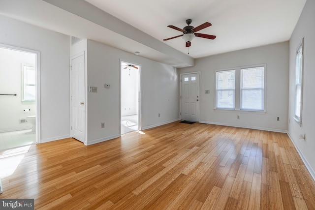 unfurnished living room featuring light hardwood / wood-style floors and ceiling fan