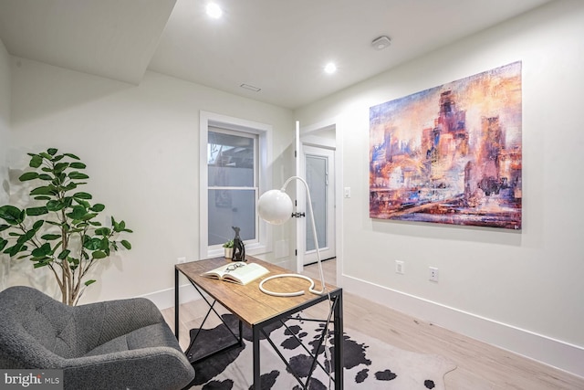 office with light wood-type flooring