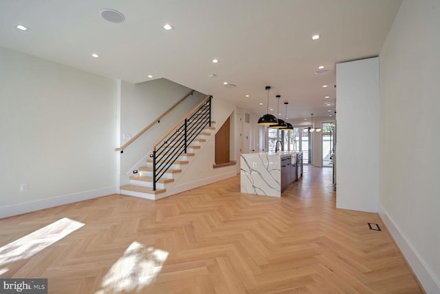 interior space featuring light parquet flooring and sink