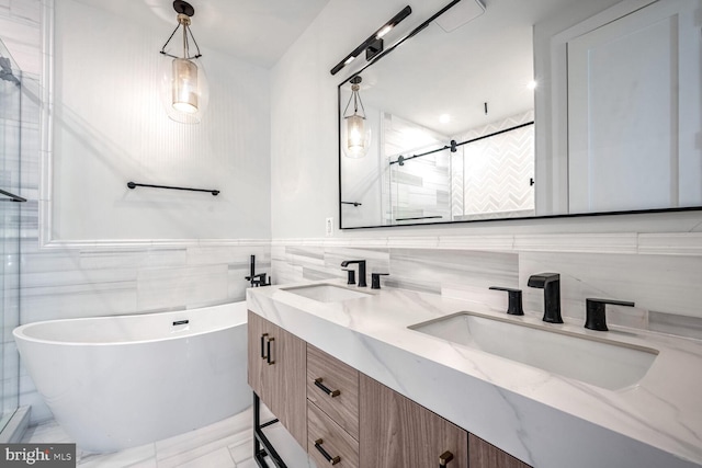 bathroom featuring vanity, tile walls, and independent shower and bath