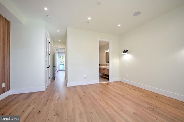 spare room featuring light wood-type flooring