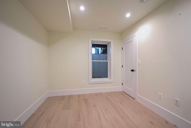 unfurnished room with light hardwood / wood-style flooring