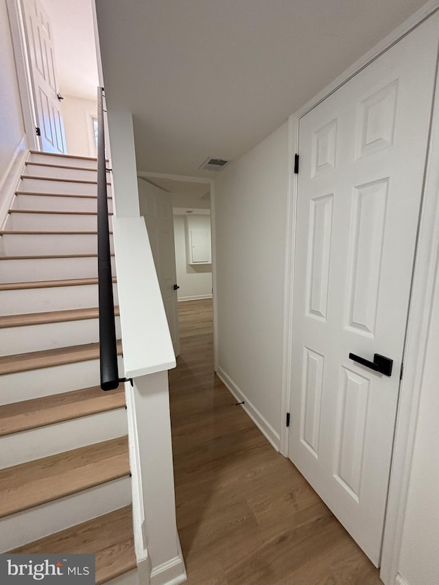 stairway with wood-type flooring