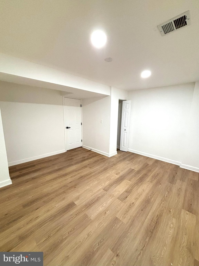 basement with light hardwood / wood-style floors