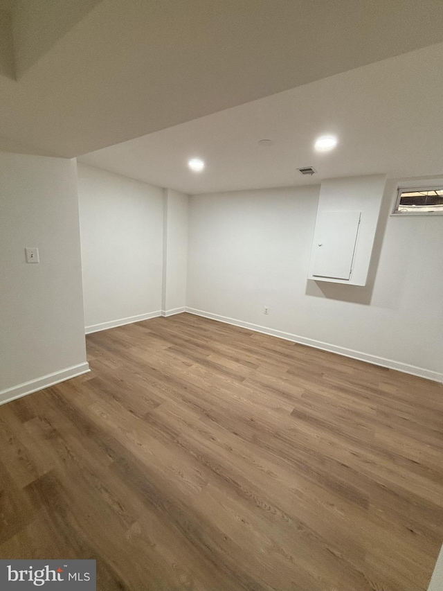 basement with wood-type flooring