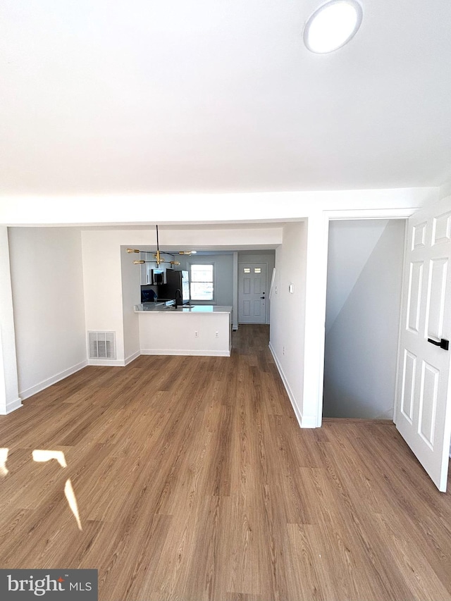 unfurnished living room featuring light hardwood / wood-style flooring