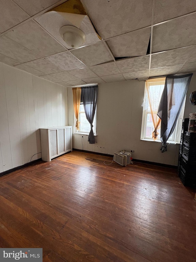 spare room with hardwood / wood-style floors