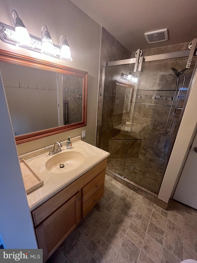 bathroom featuring vanity and walk in shower