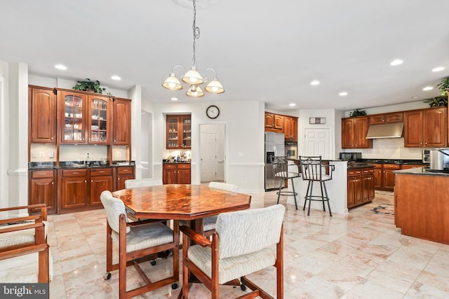 dining space with an inviting chandelier