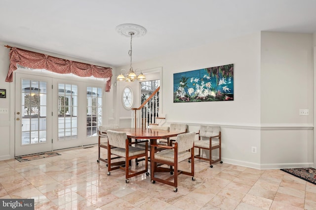 dining space featuring a chandelier