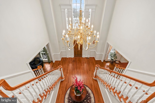 interior space with hardwood / wood-style floors and a chandelier