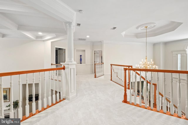 hallway featuring crown molding, light carpet, a raised ceiling, a notable chandelier, and beam ceiling