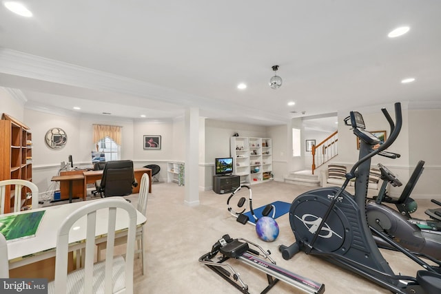 exercise room featuring light colored carpet and crown molding