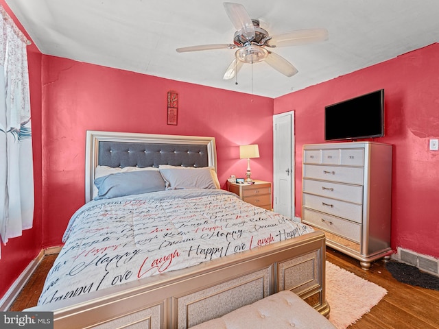 bedroom featuring ceiling fan and dark wood-type flooring