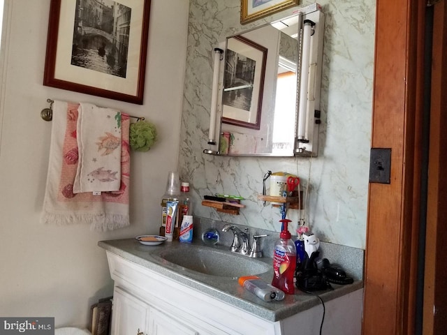 bar with white cabinets and sink