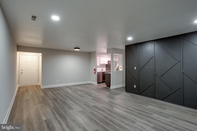 unfurnished living room with light wood-type flooring