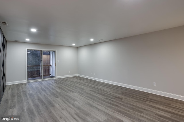 unfurnished room with hardwood / wood-style floors