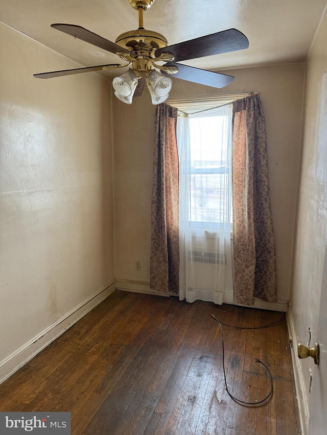 unfurnished room featuring dark hardwood / wood-style floors