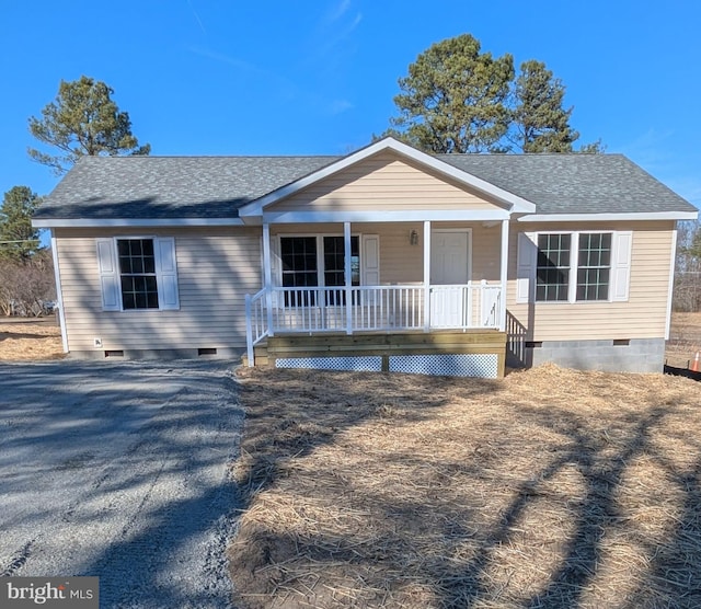 view of front of house featuring a porch, crawl space, and a shingled roof