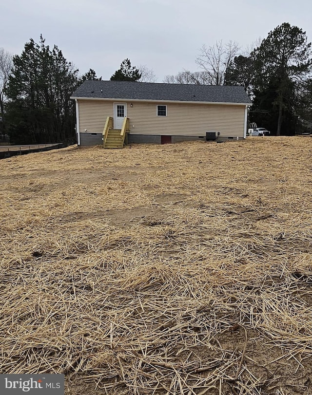 back of house with crawl space and entry steps