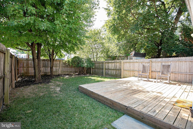 view of yard featuring a wooden deck