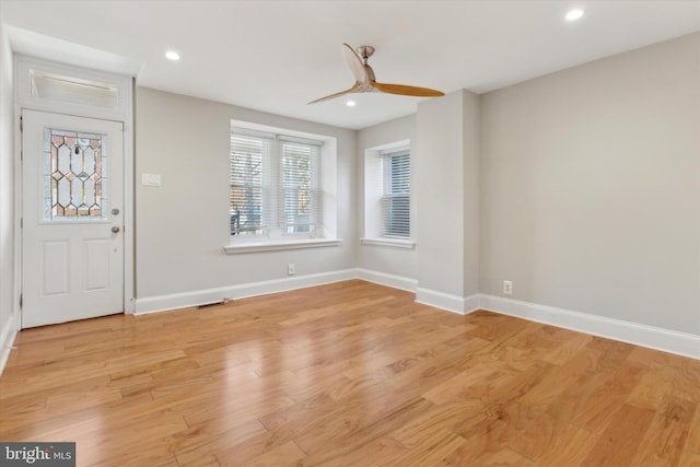 foyer featuring ceiling fan and light hardwood / wood-style flooring