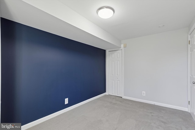 empty room featuring light carpet