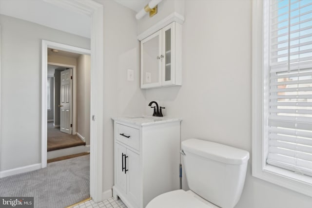 bathroom featuring toilet and vanity