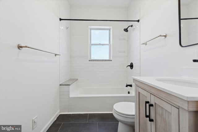 full bathroom with toilet, vanity, tile patterned floors, and tiled shower / bath combo