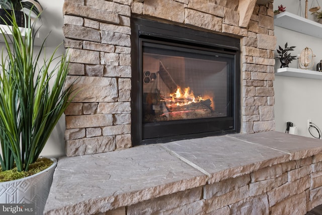 room details featuring a stone fireplace