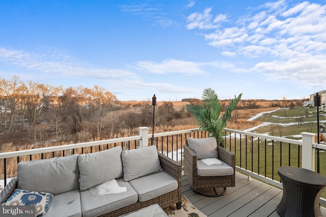 wooden terrace with outdoor lounge area