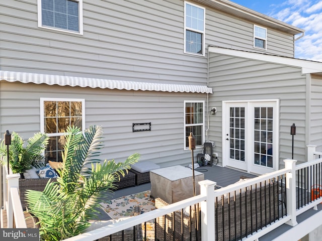 back of house with a wooden deck