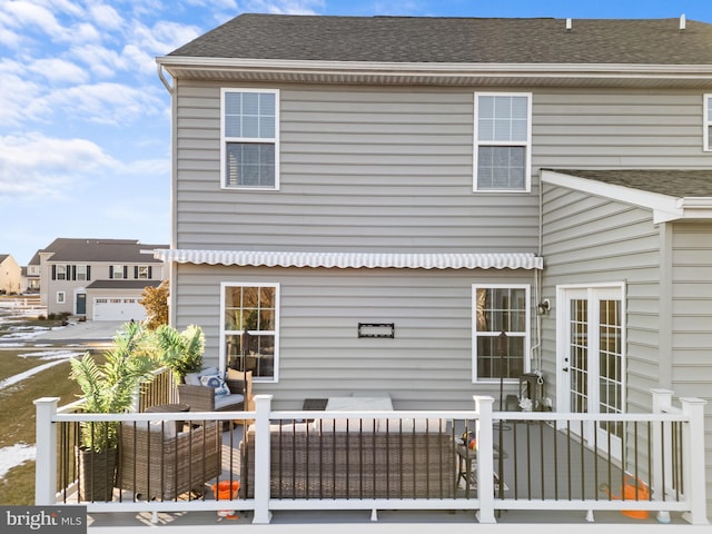 rear view of house with outdoor lounge area