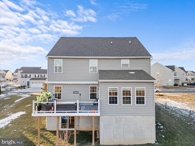 rear view of house featuring a deck