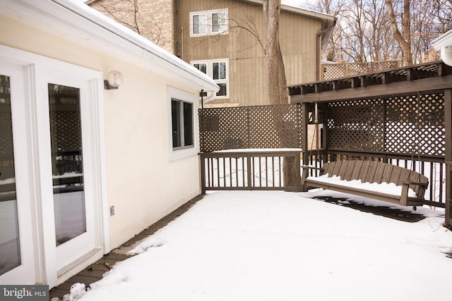 view of snow covered deck