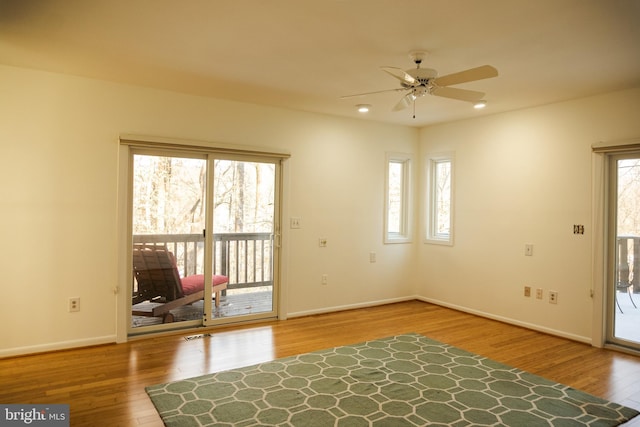 entryway featuring visible vents, baseboards, a ceiling fan, wood finished floors, and recessed lighting