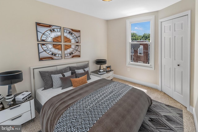 bedroom with carpet flooring and a closet