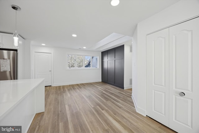 unfurnished living room featuring light hardwood / wood-style flooring