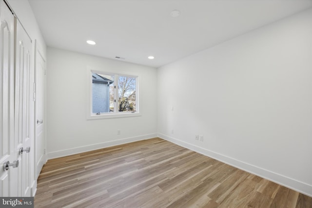 unfurnished room featuring light hardwood / wood-style floors