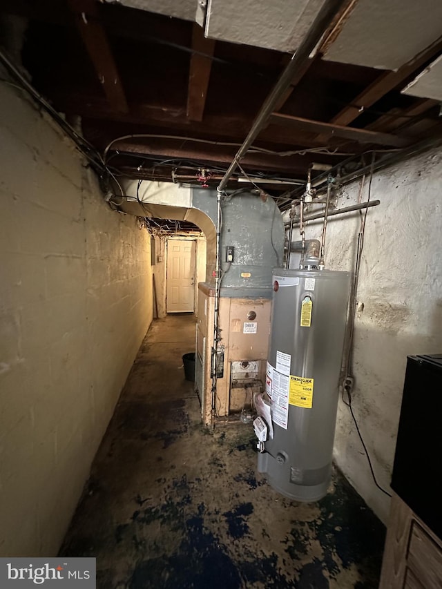 utility room with heating unit and water heater