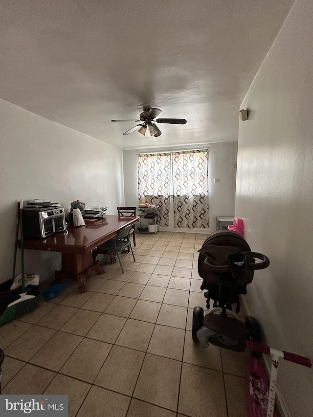 dining room featuring light tile patterned flooring and ceiling fan