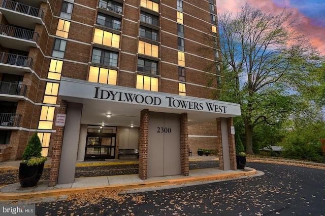 view of outdoor building at dusk