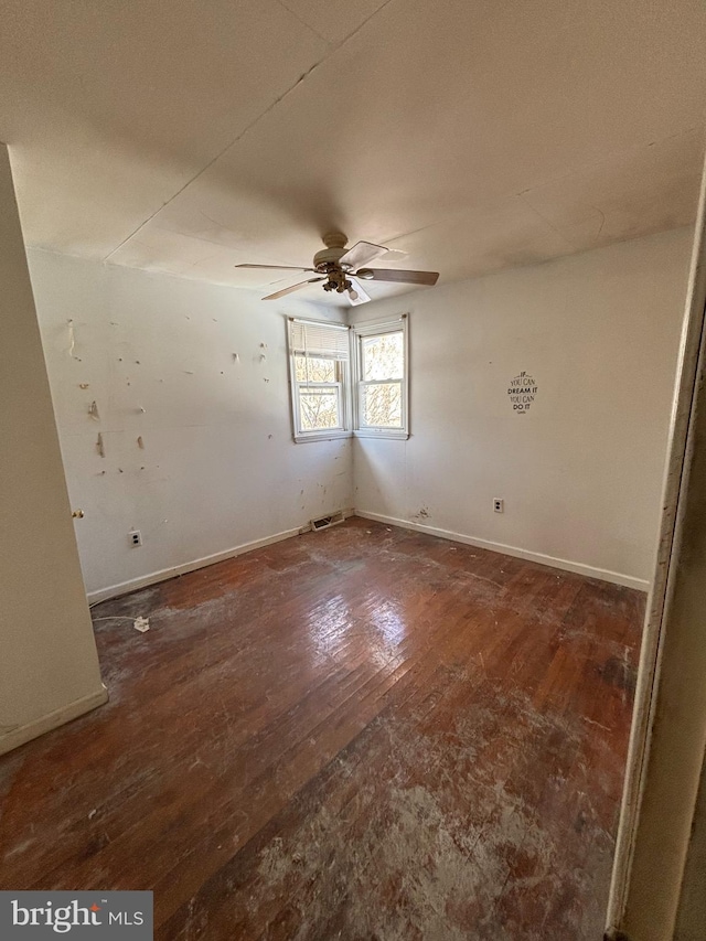 unfurnished room featuring ceiling fan and dark hardwood / wood-style floors