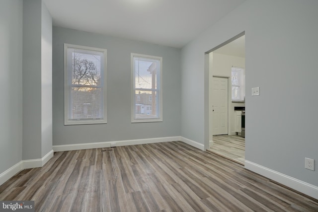 spare room with light hardwood / wood-style flooring