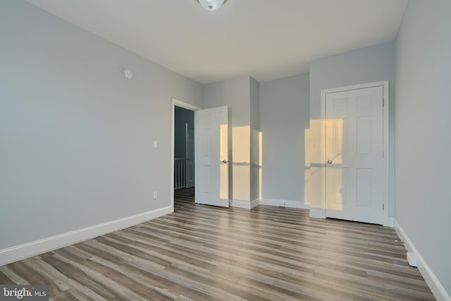 unfurnished bedroom featuring light wood-type flooring