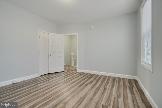 unfurnished room with light hardwood / wood-style flooring