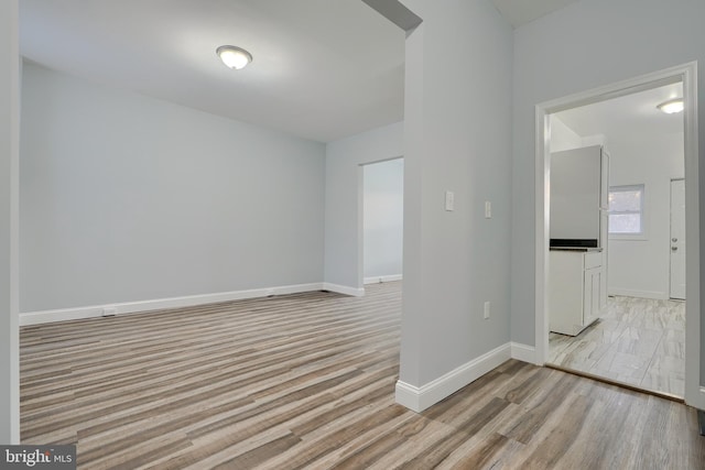 unfurnished room featuring light wood-type flooring