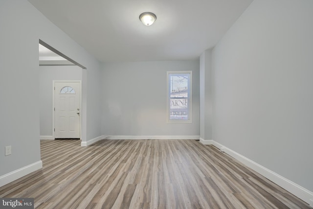 empty room with light hardwood / wood-style floors