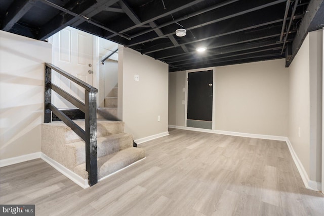 basement featuring wood-type flooring